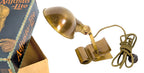 rare early 20th century "new old stock" antique american industrial clamp-on brass "adjusto-lite" single light fixture with rolled rim brass parabolic shade