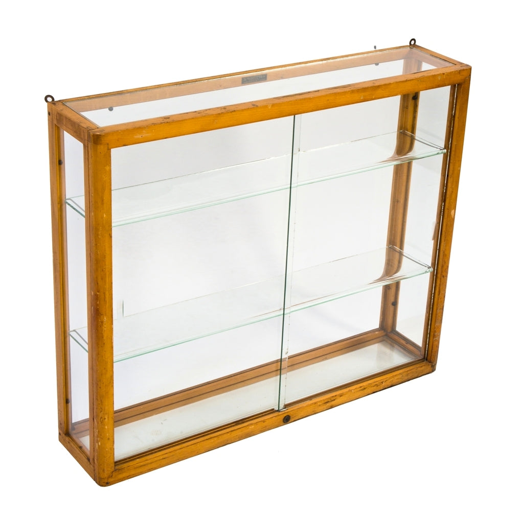 original and intact wall-mount early 1930's american depression-era waddell varnished maple wood compact display case with plate glass sliding doors and adjustable shelves