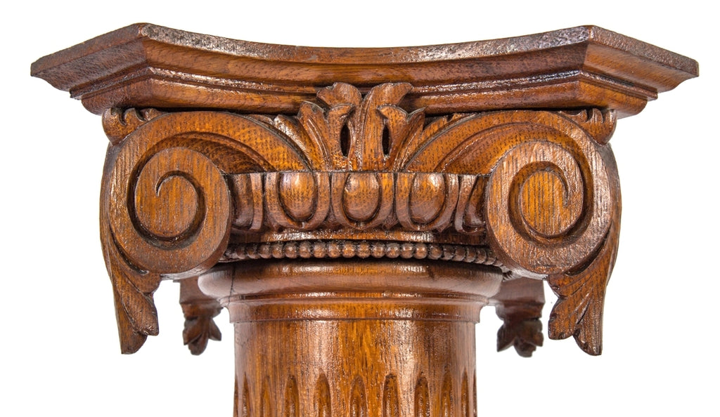 two matching original and intact carved solid oak wood salvaged chicago 19th century victorian era fluted columns with heavily ornamented capitals