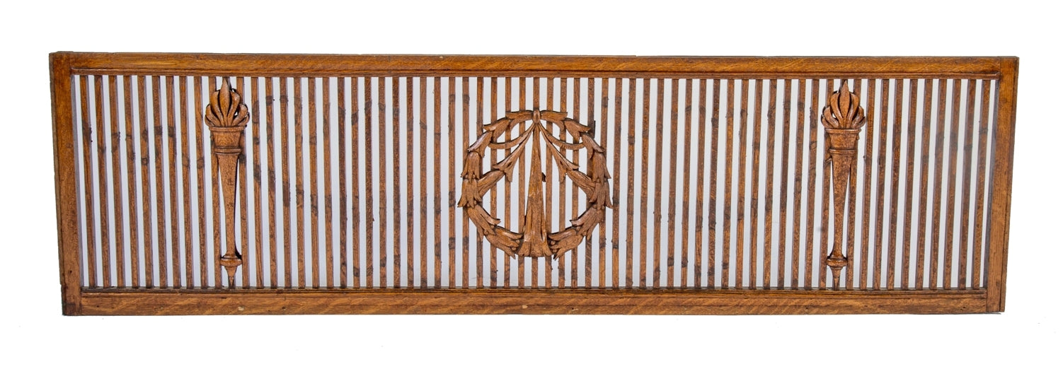 high victorian era double-sided 19th century interior residential room divider wood grille with centrally located laurel wreath flanked by torches