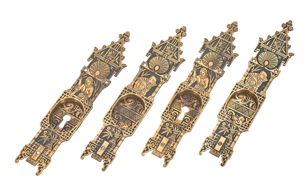 one of four original and well-maintained ornamental cast bronze angle-japanese style oversized interior residential pocket door handles or pulls with nicely aged surface patina