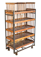 all original and completely intact early 20th century mobile "neverax" angled steel and wood compartmentalized carrying rack