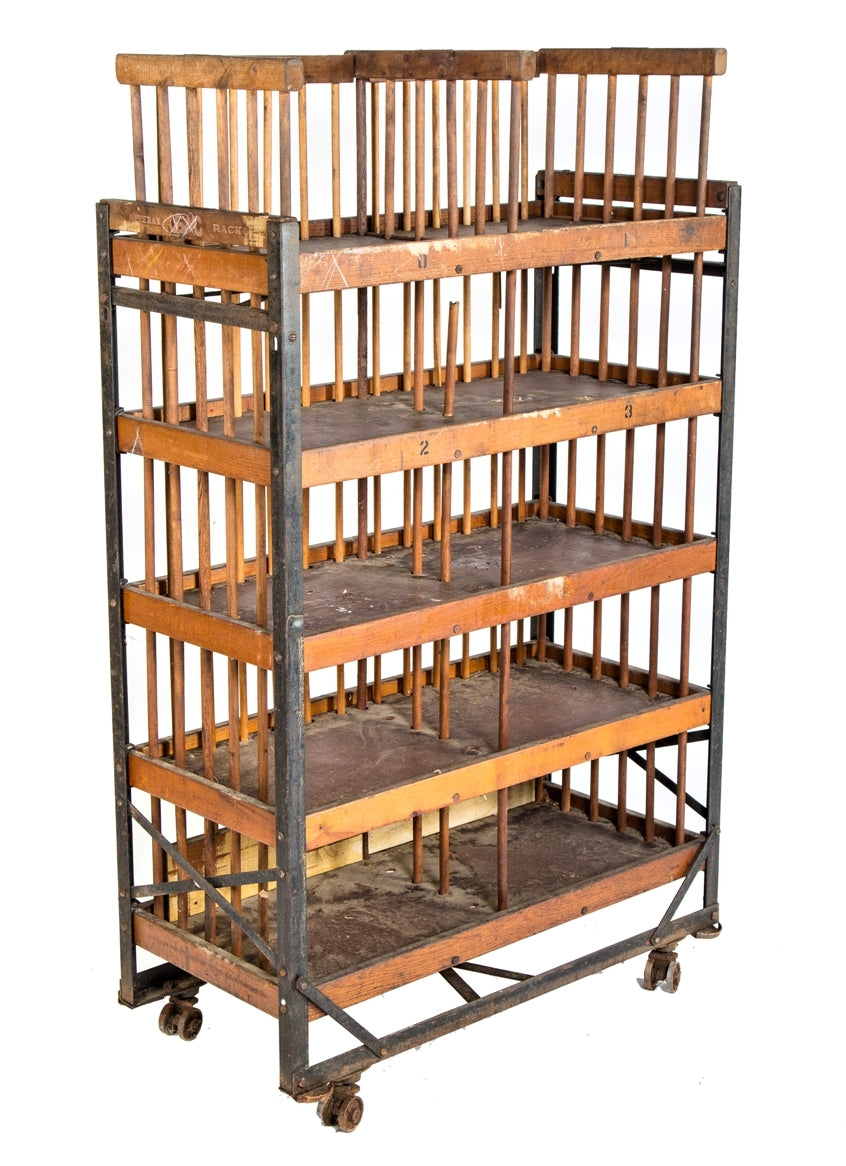 all original and completely intact early 20th century mobile "neverax" angled steel and wood compartmentalized carrying rack