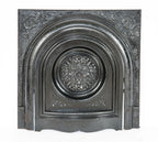 original and intact late 19th century heavily ornamented black enameled salvaged chicago "peerless" interior residential fireplace grille or grate with matching surround