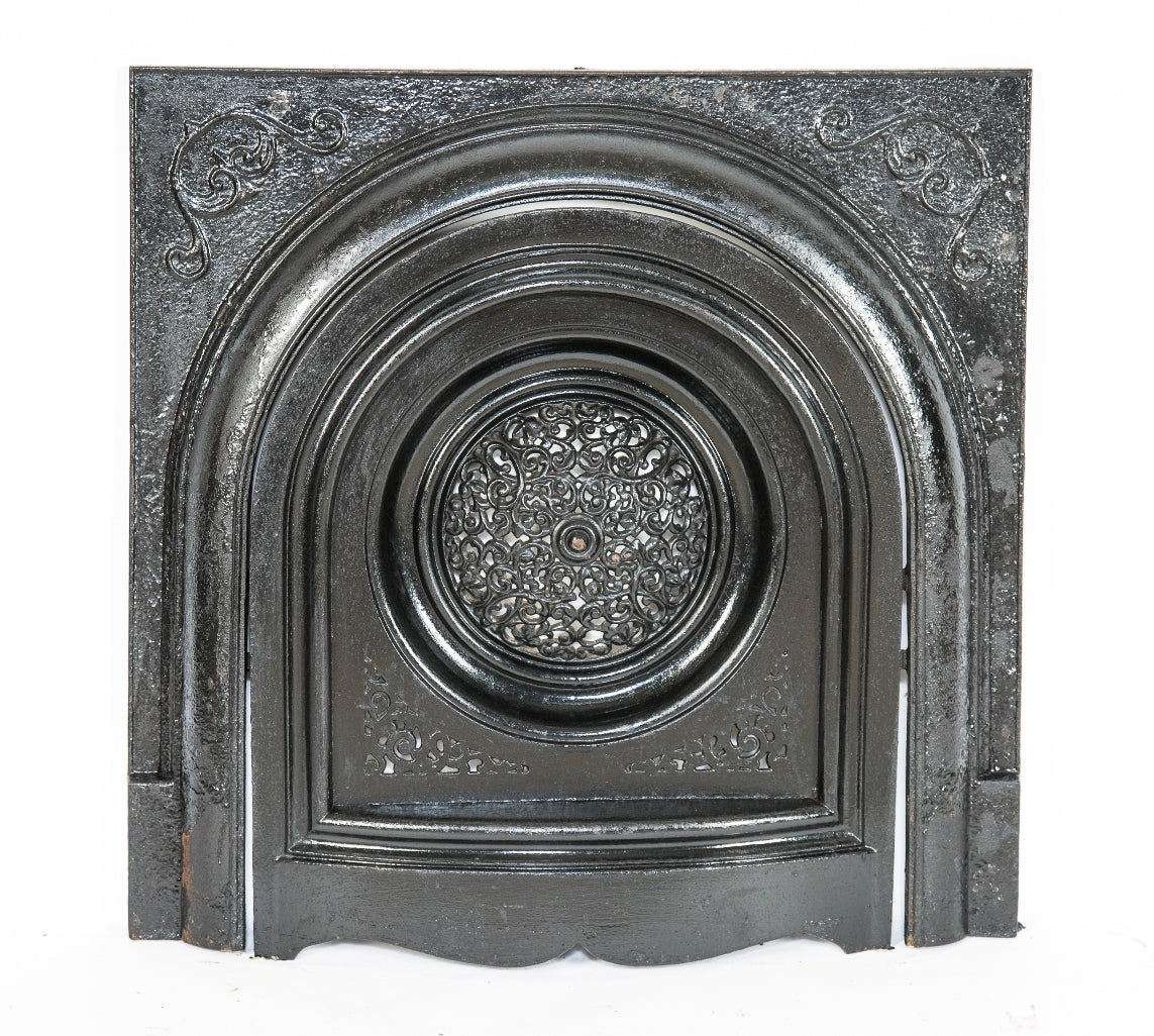 original and intact late 19th century heavily ornamented black enameled salvaged chicago "peerless" interior residential fireplace grille or grate with matching surround