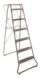 american depression era antique industrial reinforced tubular brushed metal collapsible ladder with riveted joint rungs or steps and oversized raised edge tray