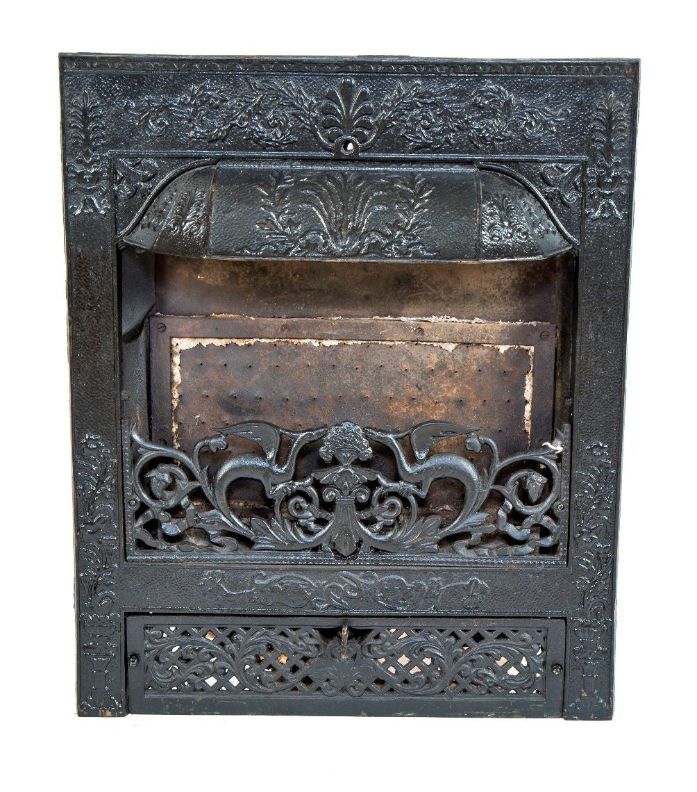 exceptional antique american dawson brothers interior residential ornamental cast iron salvaged chicago fireplace insert with mostly uniform black enameled finish and winged dragon grille
