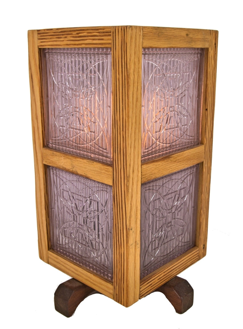 one of several matching repurposed single electric light table or desk lamp with custom-built wood surround accentuated with original early 20th century frank lloyd wright-designed prism tiles