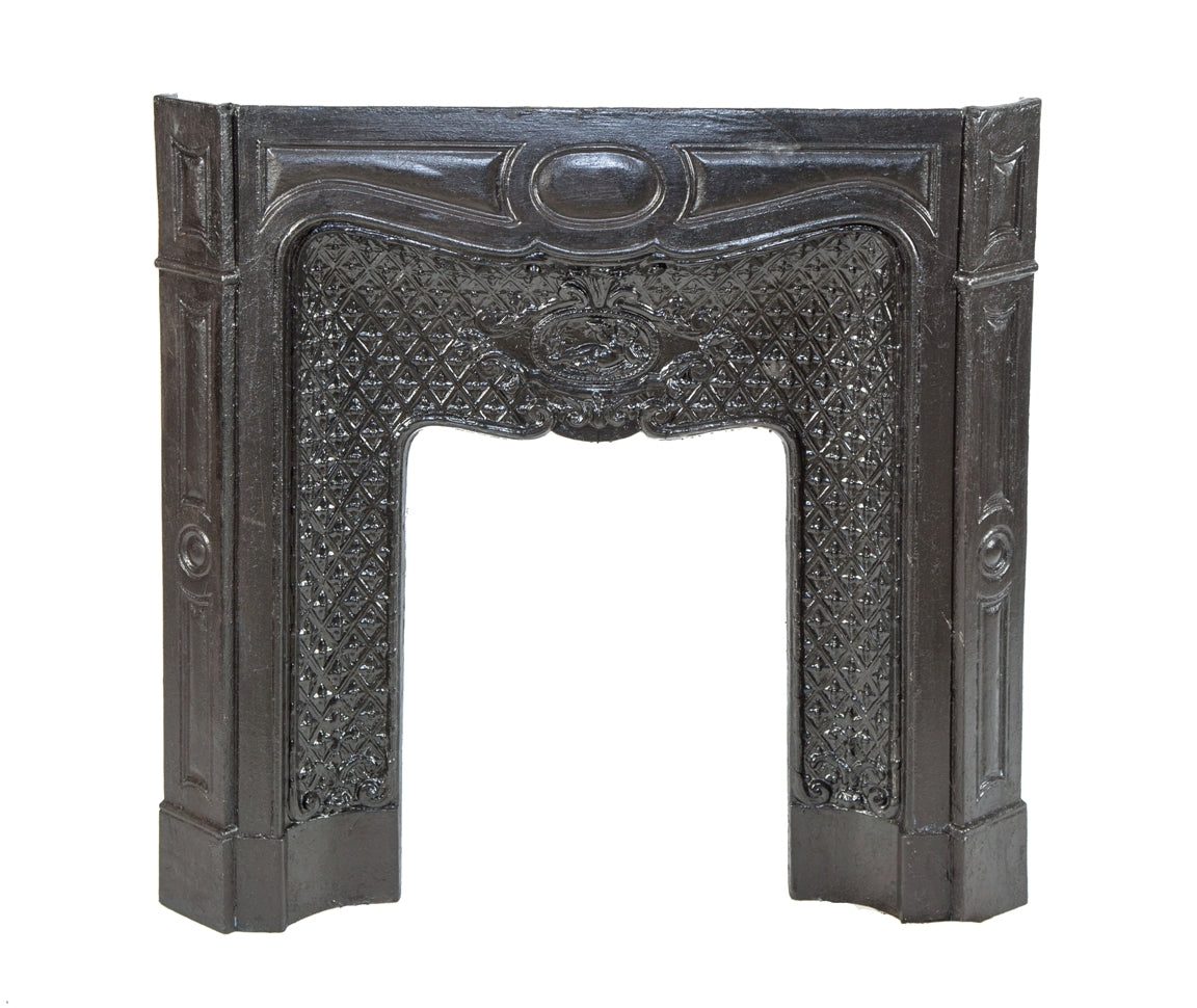 late 19th or early 20th century salvaged ornamental cast iron interior hotel building fireplace mantel with centrally located winged cherub