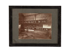 rare original and intact late 19th or early 20th century sepia-toned gelatin silver print of a building sign shop studio interior located in or around winona, minnesota