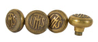 group of four matching interior logan square masonic temple building monogrammed cast brass doorknobs with nicely aged surface patina