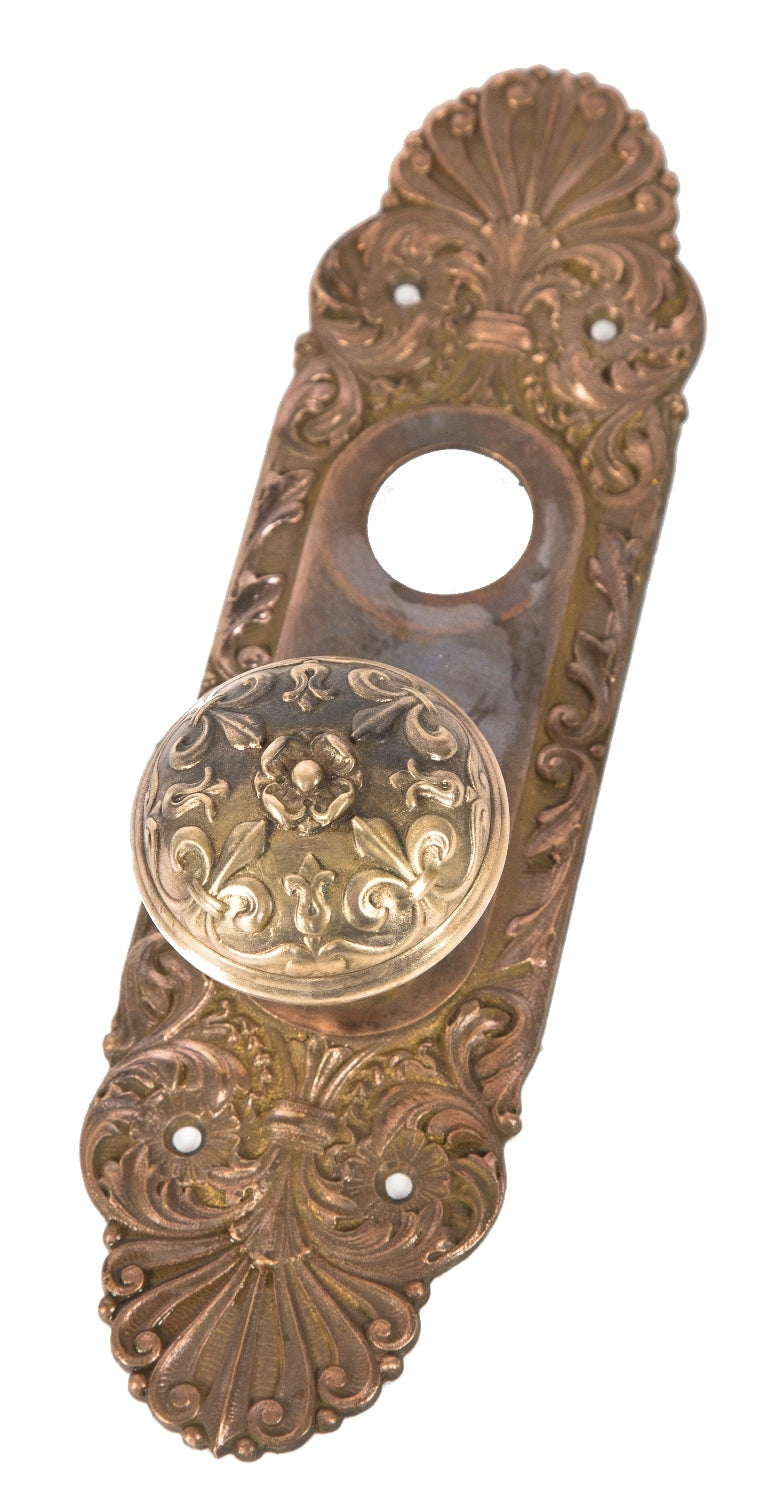 one of two matching late 19th or early 20th century ornamental cast bronze "mura" pattern salvaged chicago entrance door "mura" pattern doorknob and matching backplate