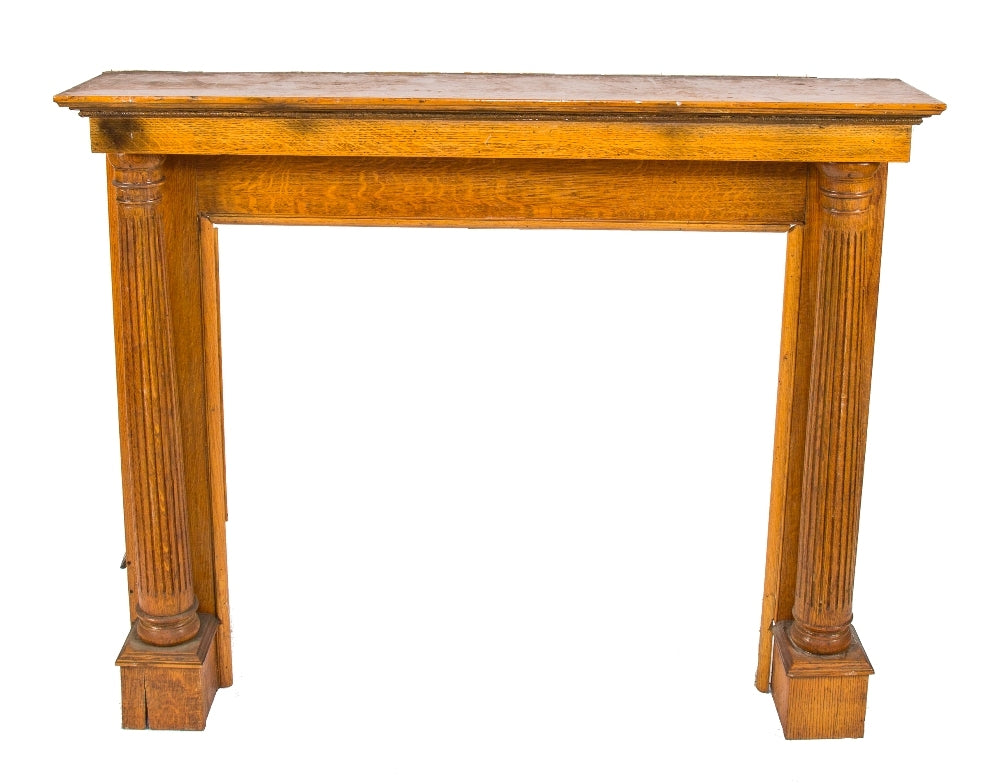original late 19th or early 20th century solid quartered oak wood interior residential salvaged chicago fireplace mantel with slightly tapered fluted columns and large firebox opening