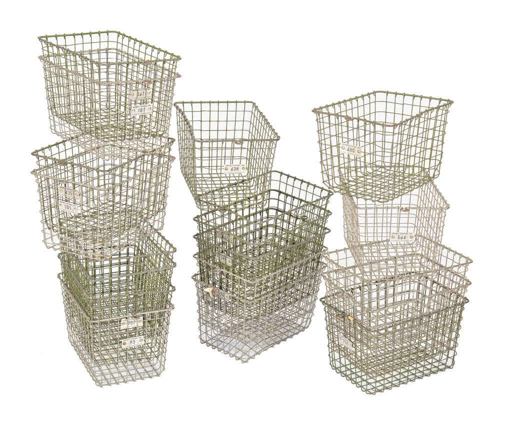 several matching vintage american industrial salvaged "medart" metal wire locker room baskets with numbered aluminum number tags
