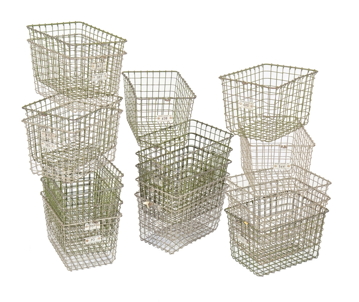 several matching vintage american industrial salvaged "medart" metal wire locker room baskets with numbered aluminum number tags