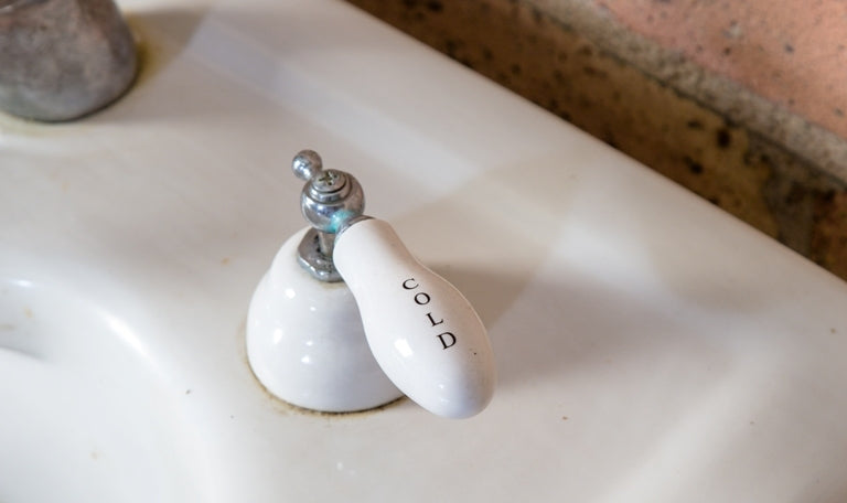 completely intact all original salvaged chicago early 20th century antique american residential lavatory sink with tapered base and porcelain hot and cold handles