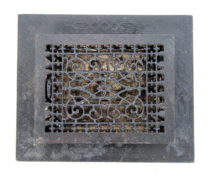 original and intact late 19th century black enameled ornamental cast iron louvered interior residential floor register or grate with intact surround
