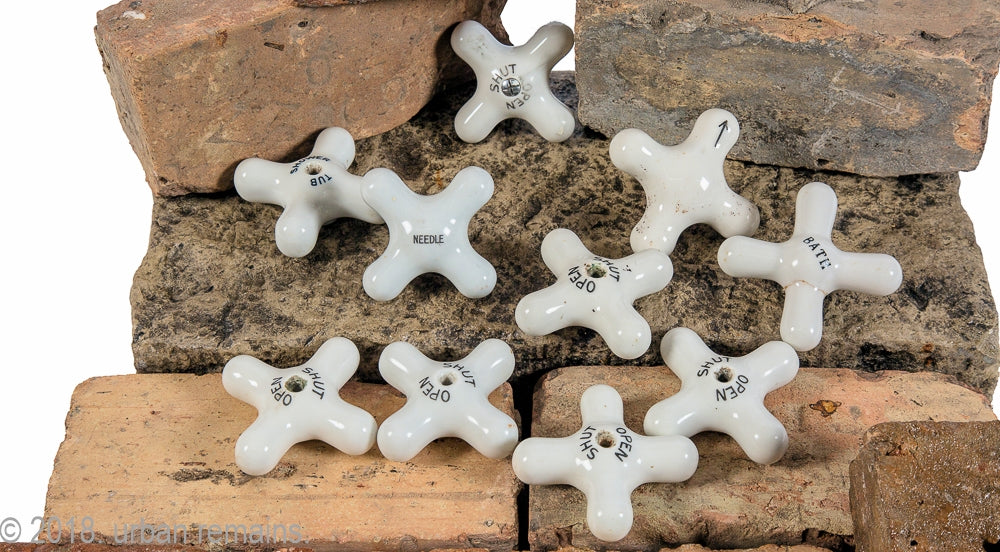 group of original late 19th or early 20th century salvaged chicago white china or porcelain cross-arm faucet handles for sink, shower, or bathtub