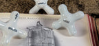 group of three rare late 19th or early 20th century white porcelain or china cross-arm interior residential bathroom needle shower handles
