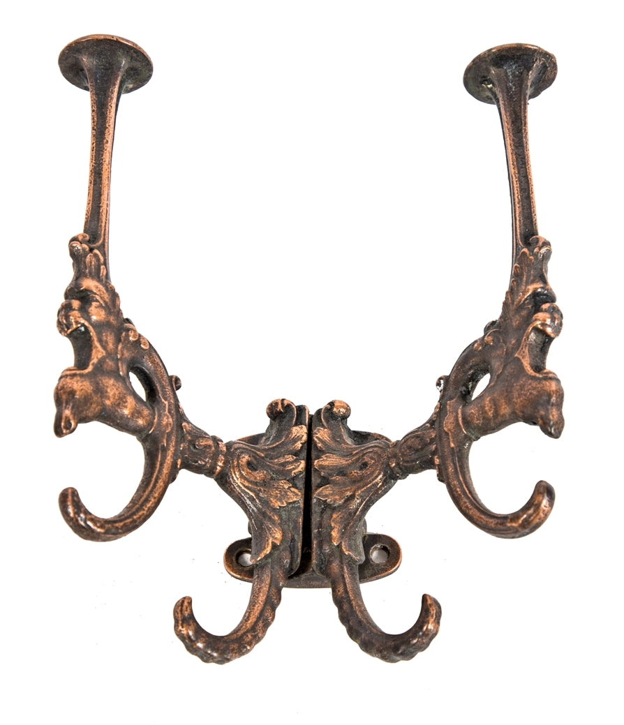 original late 19th century american victorian era copper-plated cast iron grotesque profile double-sided wall or surface-mount coat hooks