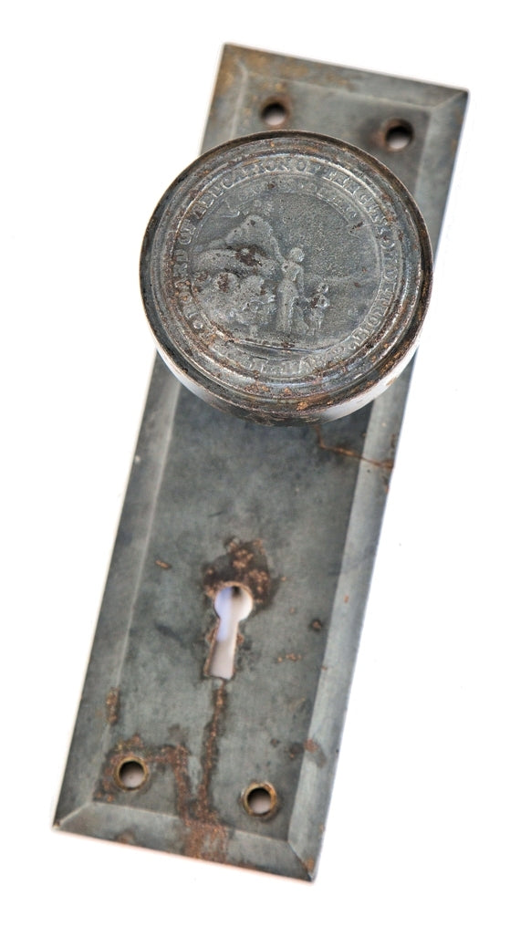 early 20th century original salvaged detroit board of education bower-barff finished cast iron emblematic doorknob and matching backplate