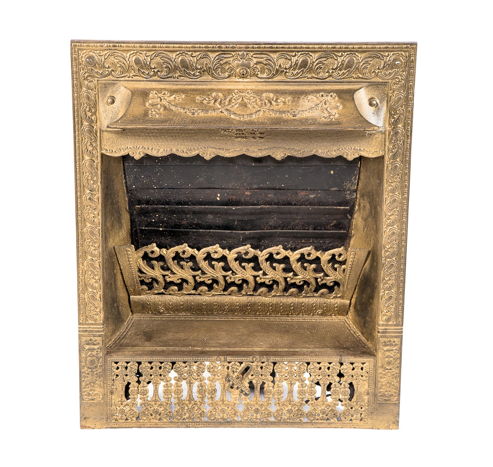 ornamented 19th century original and largely intact antique american gold enameled cast iron interior residential fireplace gas burning insert or grille with flue hande and shut off key