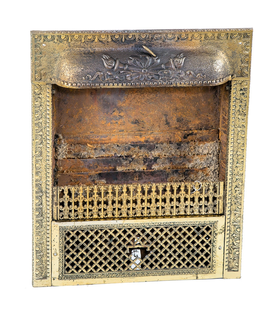 late 19th or early 20th century antique american ornamental stamped or pressed steel interior residential fireplace gas grate with overlapping fluted torches