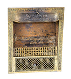 late 19th or early 20th century antique american ornamental stamped or pressed steel interior residential fireplace gas grate with overlapping fluted torches