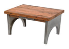 simple and repurposed american industrial stationary low-lying coffee table with brushed metal bases and single sliding drawer