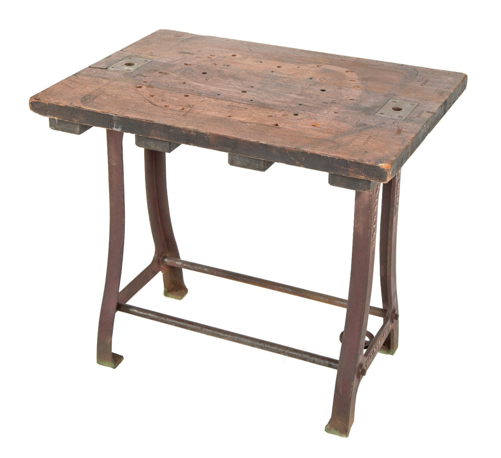 remarkable late 19th or early 20th century antique american industrial machine shop table with curvesous cast iron legs and nicely weathered and worn tabletop