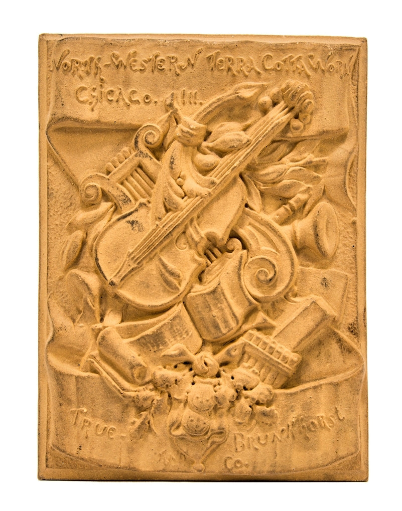 very rare early 1880's buff-colored ornamental terra cotta "salesman sample" chicago northwestern company plaque with unique assemblage of instruments