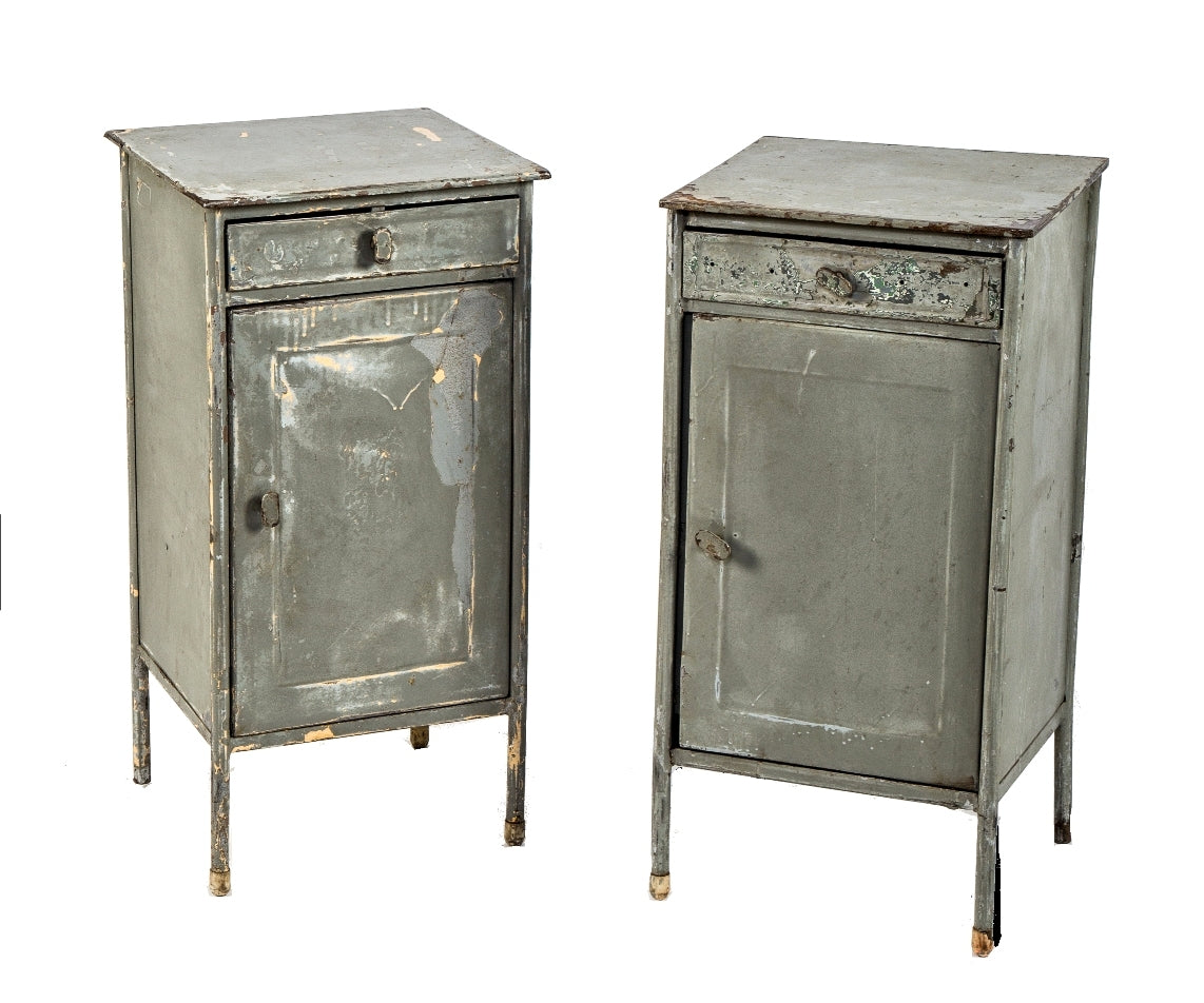 two matching c. 1930's freestanding weathered and worn industrial enameled steel side table with single drawers and cabinet doors