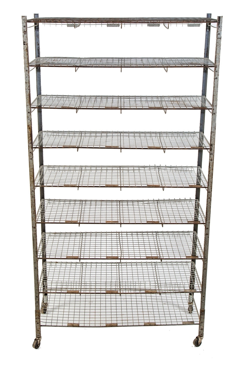 oversized vintage american industrial multi-tier salvaged chicago school mobile metal shelving unit built for hosing numbered locker room baskets