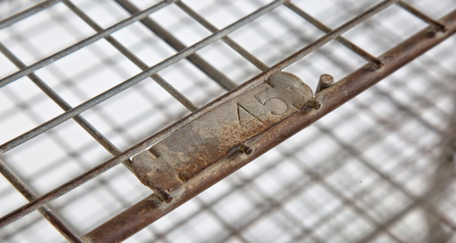 oversized vintage american industrial multi-tier salvaged chicago school mobile metal shelving unit built for hosing numbered locker room baskets