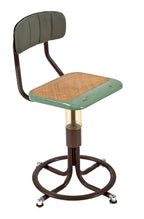 one of two nearly identical american depression era telephone company switchboard chairs or stools with adjustable height seat and curvaceous four-legged base