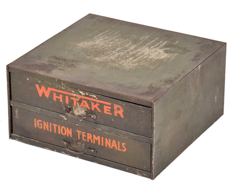 diminutive two-drawer original and intact vintage industrial "whitaker ignition terminals" pressed and folded steel storage cabinet with original finish