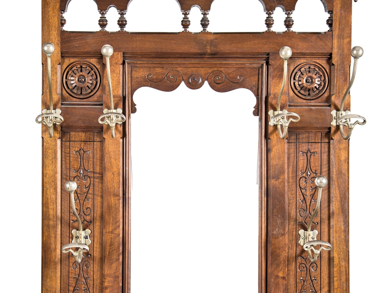 original late 19th century american eastlake or aesthetic style varnished solid walnut wood interior vestibule hall tree with oversized nickel-plated hooks and beveled mirror