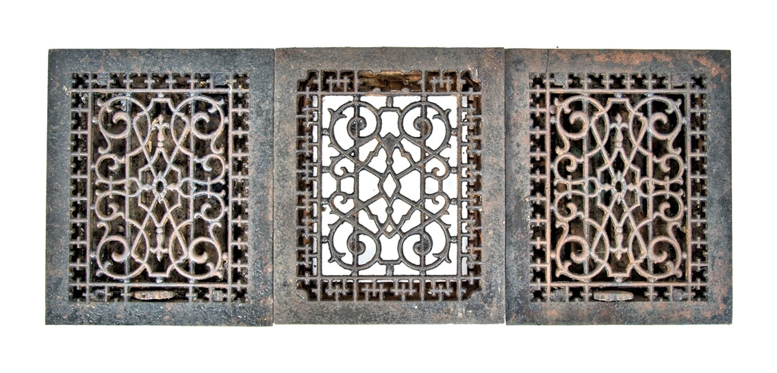 group of three matching ornamental cast iron late 19th century louvered salvaged chicago floor or wall registers with black enameled finish