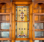 remarkable 19th century all original and intact salvaged chicago gold coast mansion varnished oak wood interior built-in cabinet with centrally located double-hung stained glass window