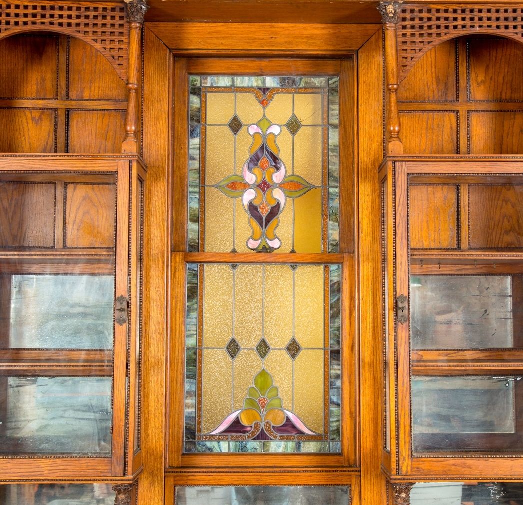 remarkable 19th century all original and intact salvaged chicago gold coast mansion varnished oak wood interior built-in cabinet with centrally located double-hung stained glass window