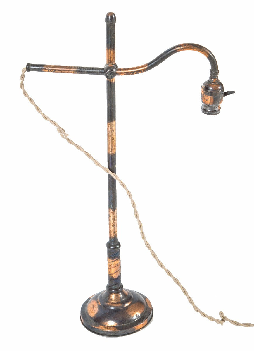 highly desirable early 20th century american industrial oxidized copper-plated single adjustable arm table lamp with braided cloth cord