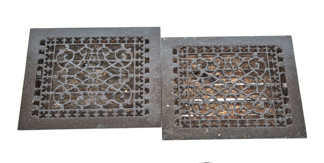 pair of original late 19th or early 20th century antique american ornamental cast iron black enameled interior residential floor registers with louvers
