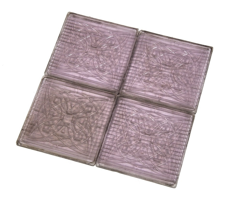 group of four original matching hard to find patented "sun-purple" colored exterior american made commercial building transom "geometric flower" prism tiles