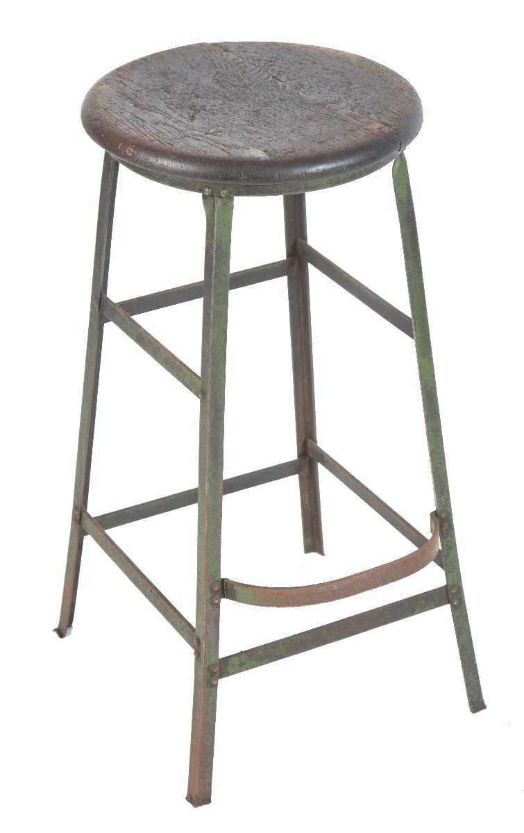 single vintage american industrial weathered and worn four-legged factory machine shop stool with solid oak wood seat