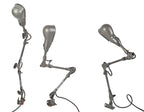 one of three matching original and fully functional triple-jointed salvaged chicago factory machine shop "slim helmet" shade task lamps