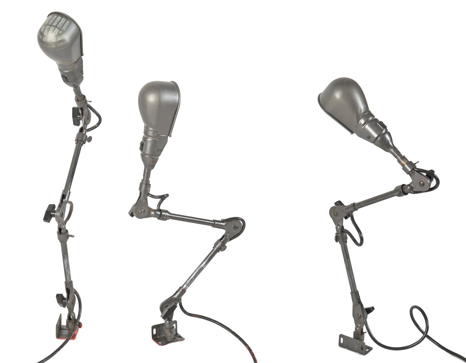 one of three matching original and fully functional triple-jointed salvaged chicago factory machine shop "slim helmet" shade task lamps