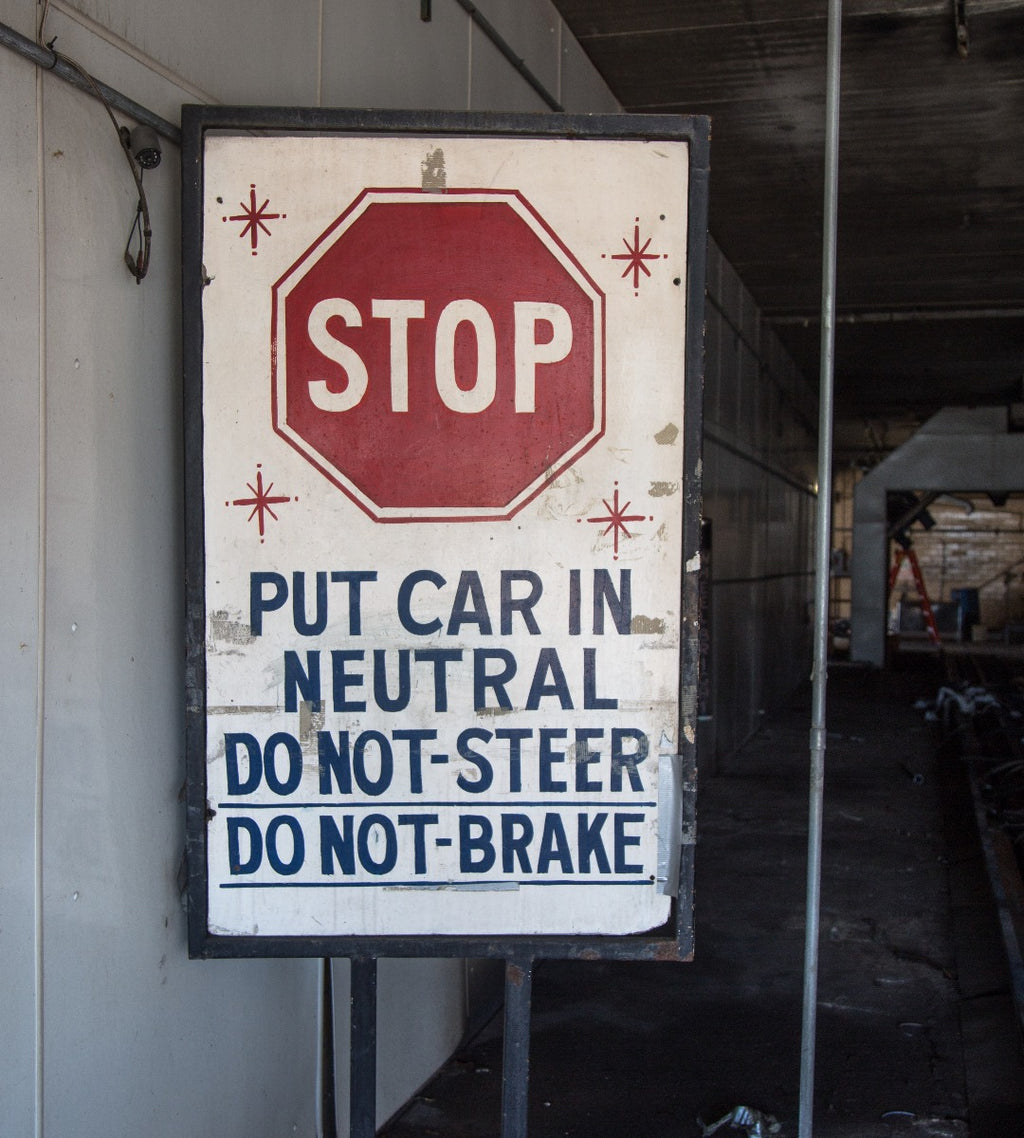 worn and weathered hand-painted salvaged chicago star car wash wood "stop" sign with bolder lettering