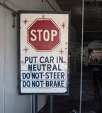 worn and weathered hand-painted salvaged chicago star car wash wood "stop" sign with bolder lettering