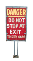 oversized custom-built salvaged chicago star car wash "danger" sign with welded-joint metal stand and bold lettering