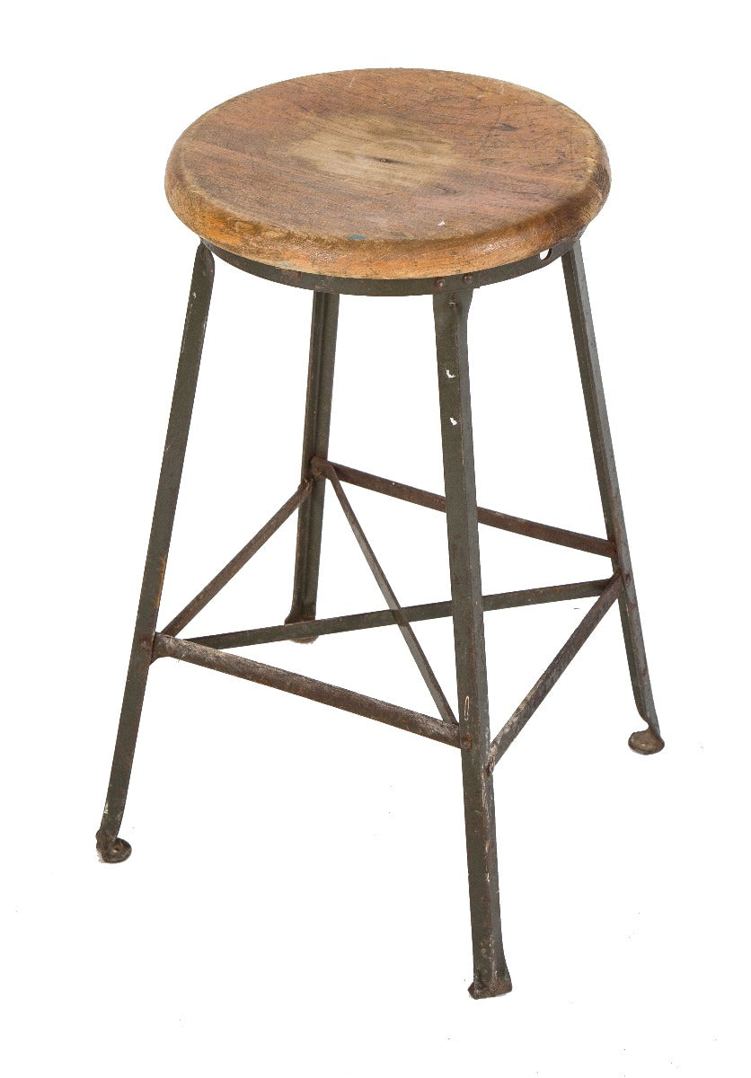 one of several salvaged chicago american depression-era angled steel stool with original wood maple top and riveted joints